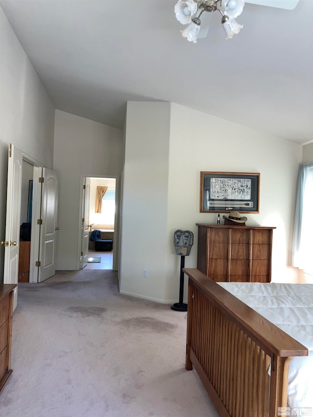 carpeted bedroom with lofted ceiling