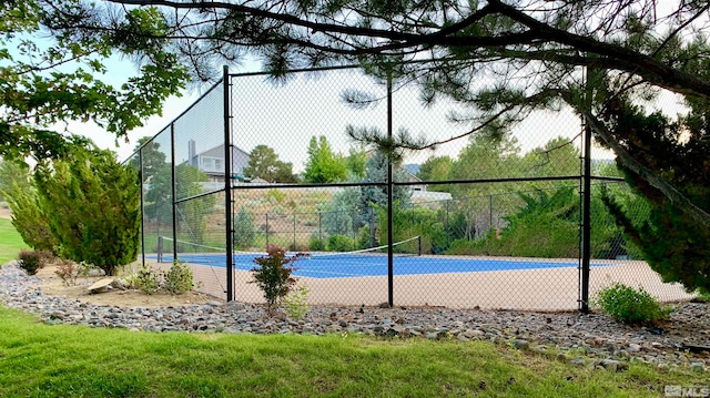 view of basketball court featuring tennis court