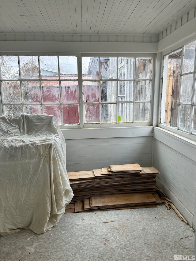 sunroom with wooden ceiling and a healthy amount of sunlight
