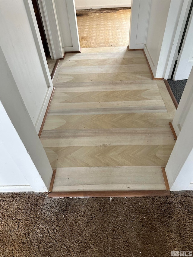 staircase featuring hardwood / wood-style flooring