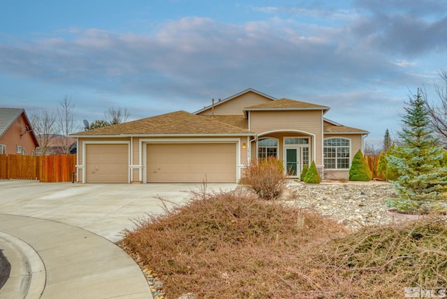 ranch-style house featuring a garage