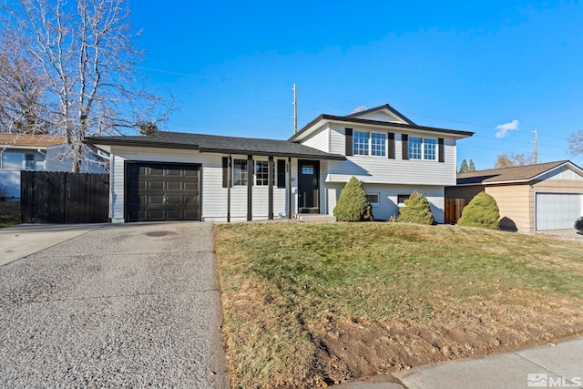 split level home featuring a front yard and a garage