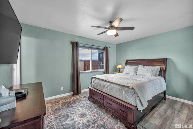 bedroom featuring ceiling fan and hardwood / wood-style floors