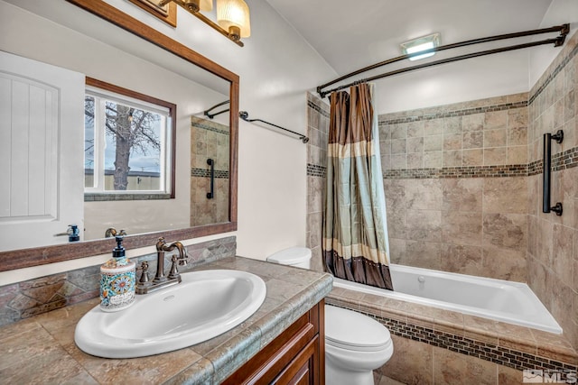 full bathroom featuring vanity, shower / bathtub combination with curtain, and toilet