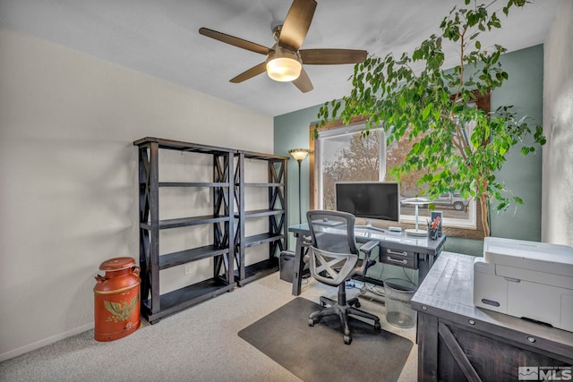 carpeted home office with ceiling fan