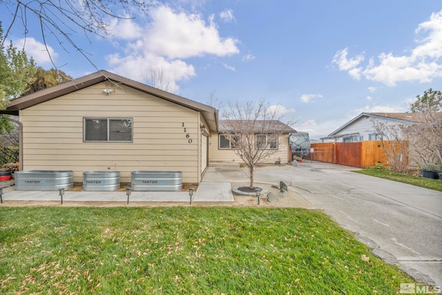 exterior space with a patio area and a yard