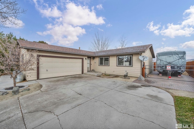 ranch-style home featuring a garage