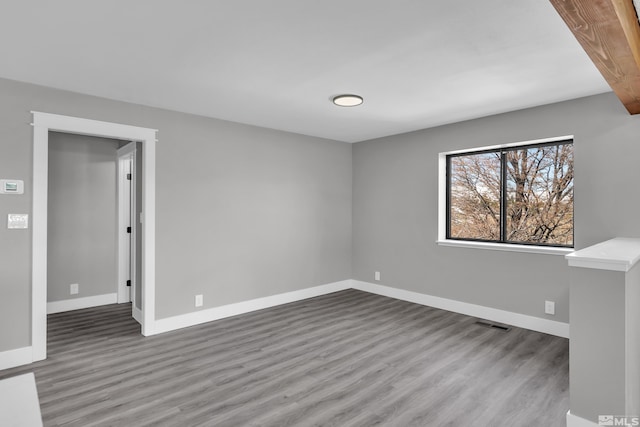 empty room with hardwood / wood-style floors