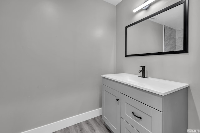 bathroom featuring vanity and wood-type flooring