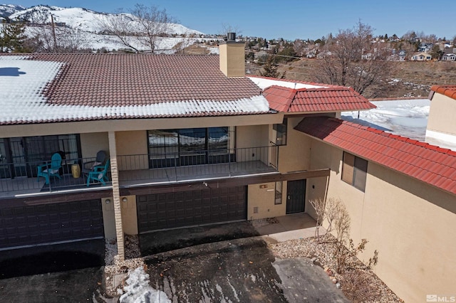 exterior space with a mountain view and a garage