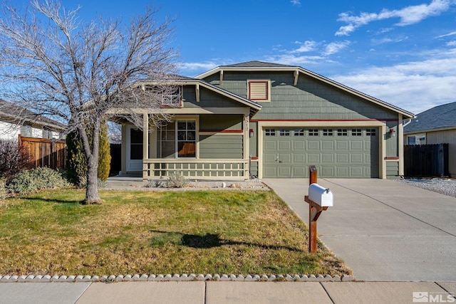 view of front of home featuring a porch, a garage, and a front lawn