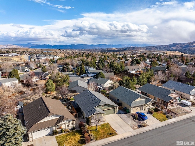 birds eye view of property featuring a mountain view