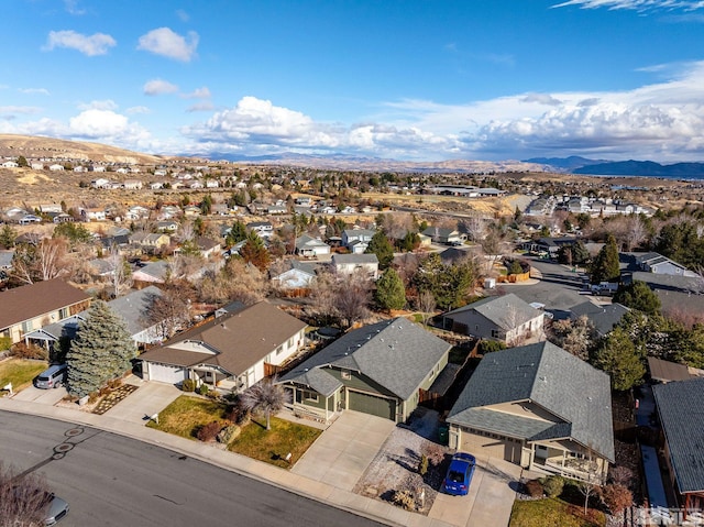 birds eye view of property featuring a mountain view