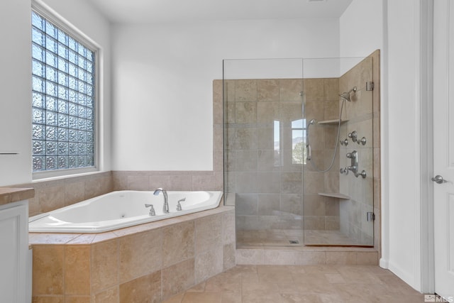 bathroom with shower with separate bathtub