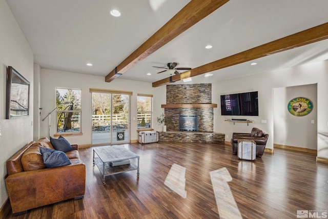 living room featuring a fireplace, beam ceiling, dark hardwood / wood-style flooring, and ceiling fan