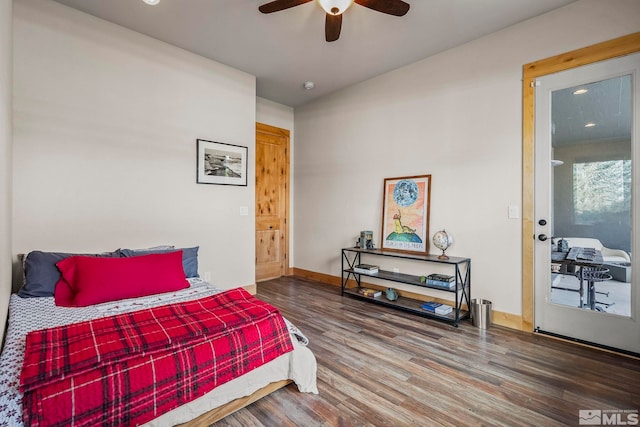 bedroom featuring hardwood / wood-style floors, ceiling fan, and ensuite bathroom