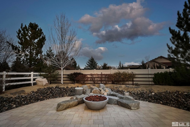 view of patio terrace at dusk