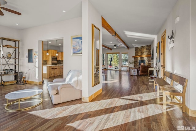 corridor with beamed ceiling and hardwood / wood-style flooring