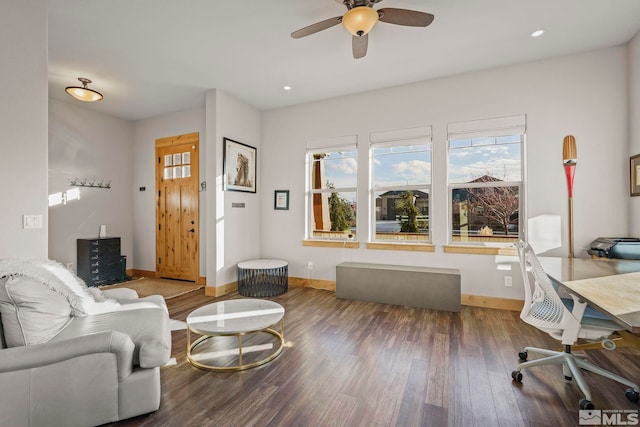 living room featuring ceiling fan and wood-type flooring