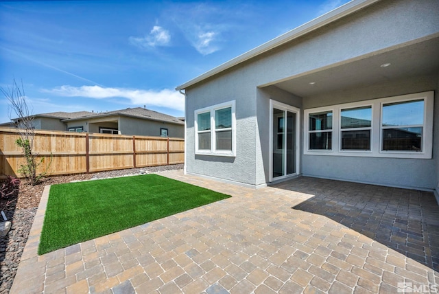 exterior space featuring fence and a patio area