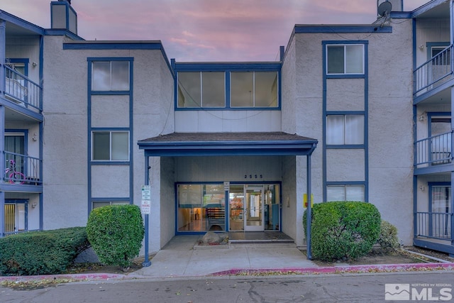 view of exterior entry at dusk