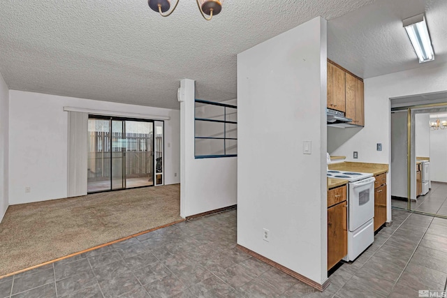 kitchen featuring white range with electric stovetop, light carpet, a chandelier, and a textured ceiling