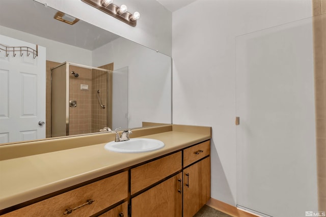 bathroom with vanity and an enclosed shower