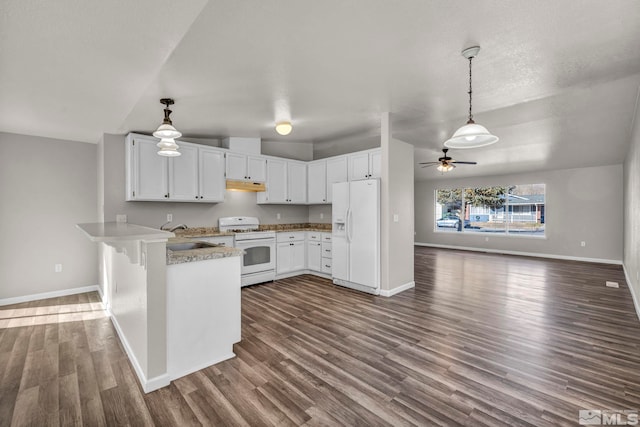 kitchen with kitchen peninsula, dark hardwood / wood-style flooring, white cabinets, and white appliances