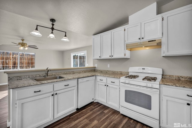 kitchen featuring kitchen peninsula, white appliances, sink, dark hardwood / wood-style floors, and white cabinetry