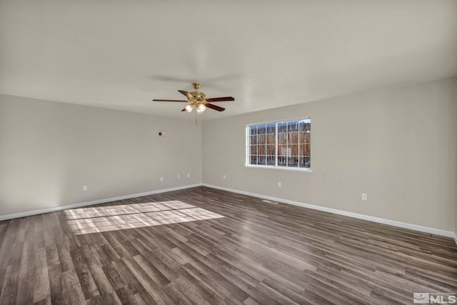 unfurnished room featuring dark hardwood / wood-style flooring and ceiling fan