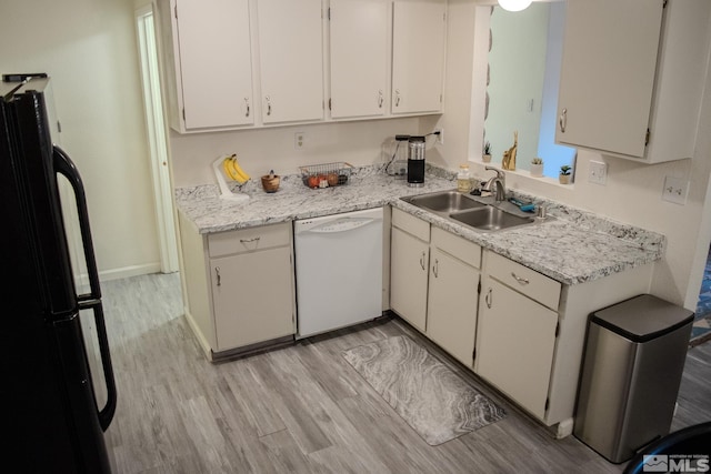 kitchen featuring white cabinetry, dishwasher, and fridge