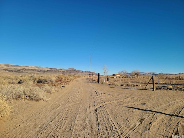 view of road featuring a mountain view and a rural view