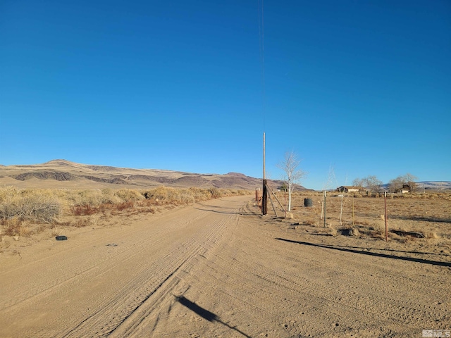 view of road featuring a mountain view and a rural view