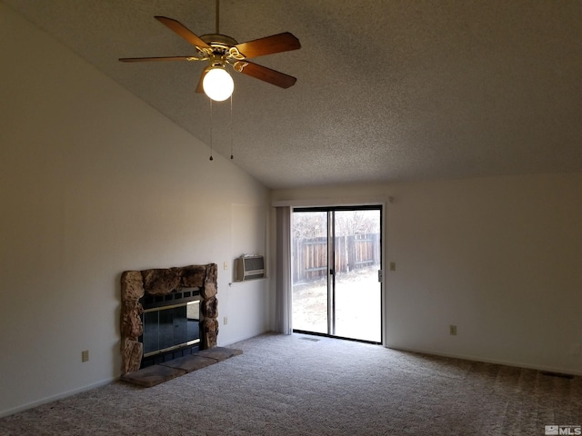 unfurnished living room featuring ceiling fan, a fireplace, carpet, and lofted ceiling