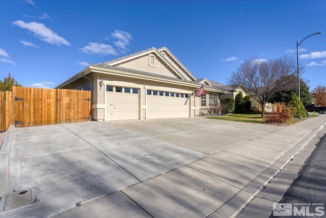 single story home featuring a garage