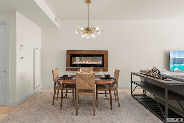 dining area with an inviting chandelier