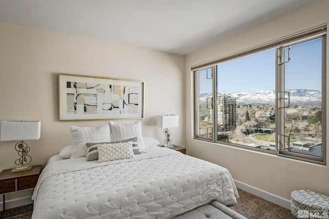 carpeted bedroom featuring a mountain view