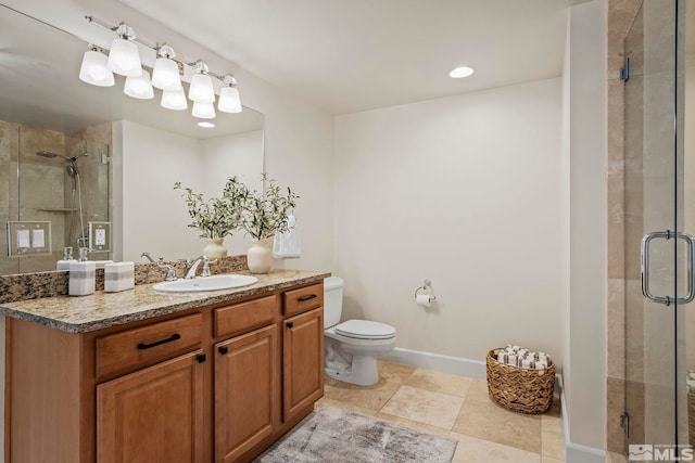 bathroom with vanity, toilet, and walk in shower