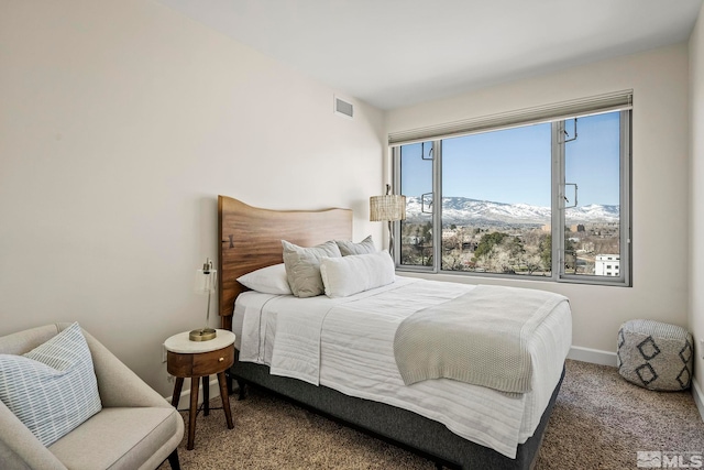 bedroom featuring a mountain view and carpet floors