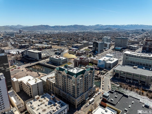 birds eye view of property featuring a mountain view