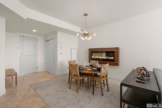 dining space with a chandelier