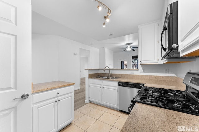 kitchen with white cabinetry, sink, ceiling fan, and stainless steel appliances