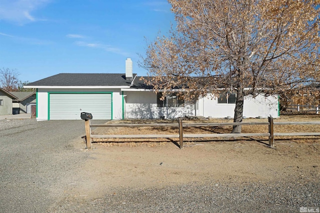 single story home featuring a garage