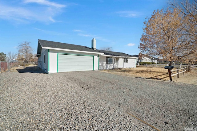 ranch-style home with a garage