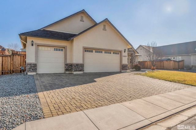 view of front of property with a garage and a front lawn