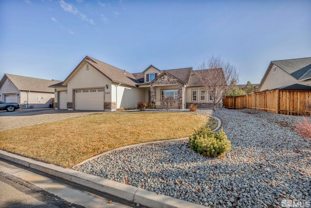 view of front of home with a garage and a front lawn