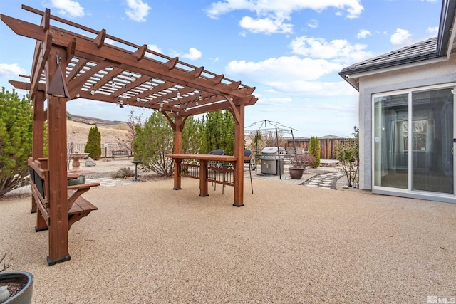 exterior space featuring a grill and a pergola