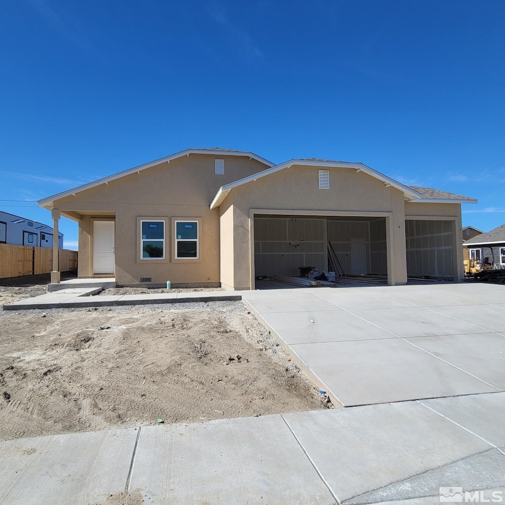 ranch-style house featuring a garage