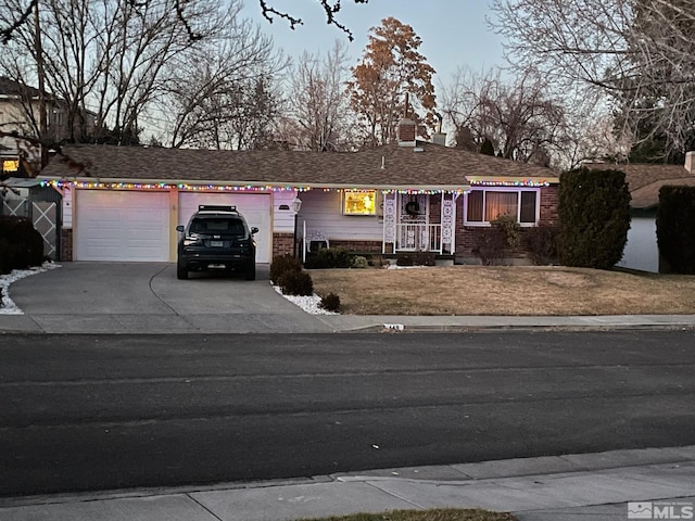 ranch-style house featuring a garage