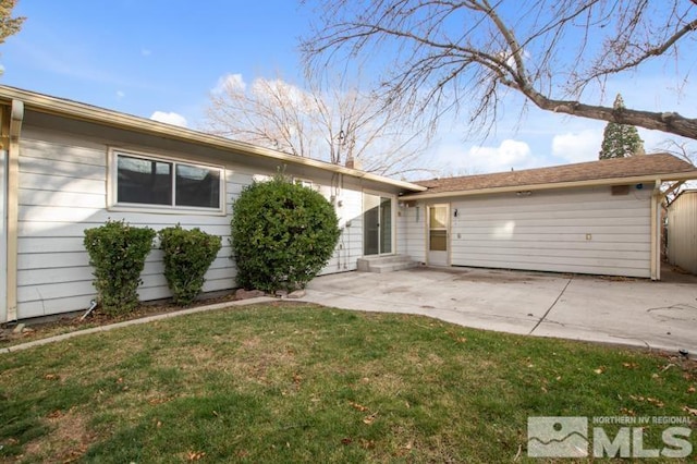 ranch-style house with a patio and a front yard